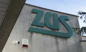 Znak ZUS. Tu złożysz wniosek o rentę rodzinną. Obok kamery i sygnalizator alarmowy.