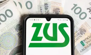 ZUS na ekranie telefonu, otoczony banknotami 100 zł. Sprawdzam, czy renta wdowia ma limit.